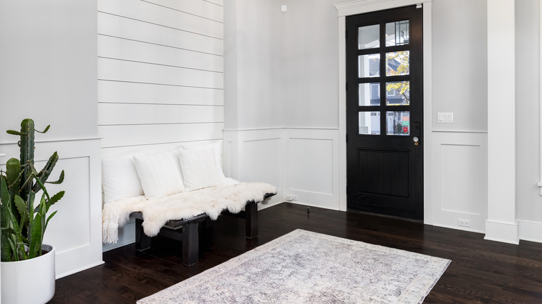 entryway with dark brown floor