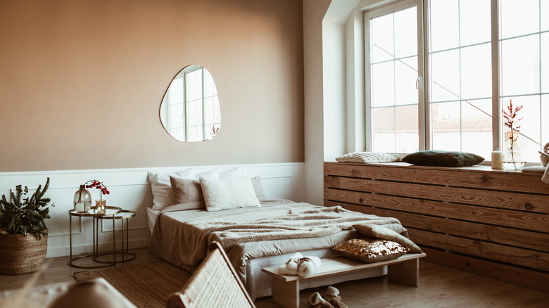 neutral bedroom with mirror