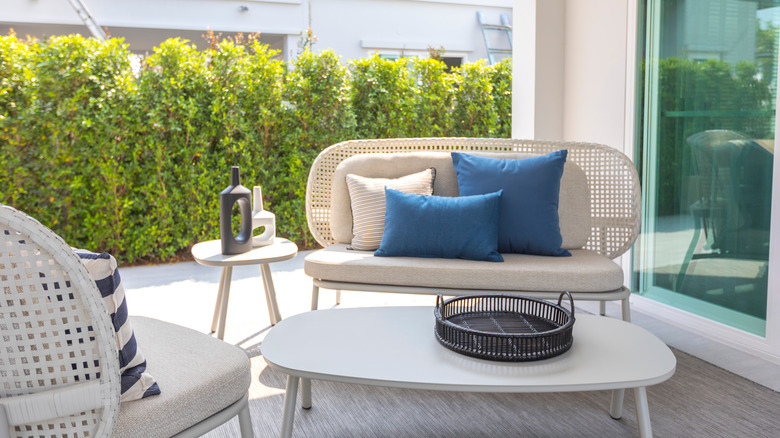 Rattan furniture with metal accents