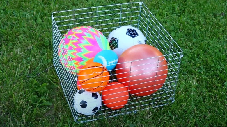 outdoor toys in wire bin