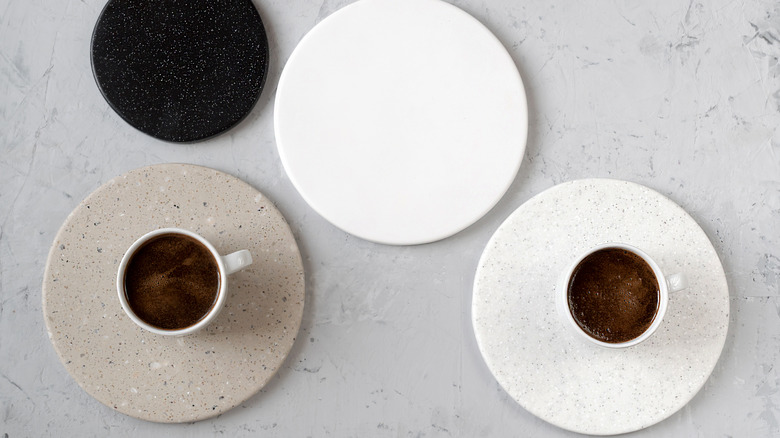 Coffee mugs on rounded coasters made from leftover countertop materials