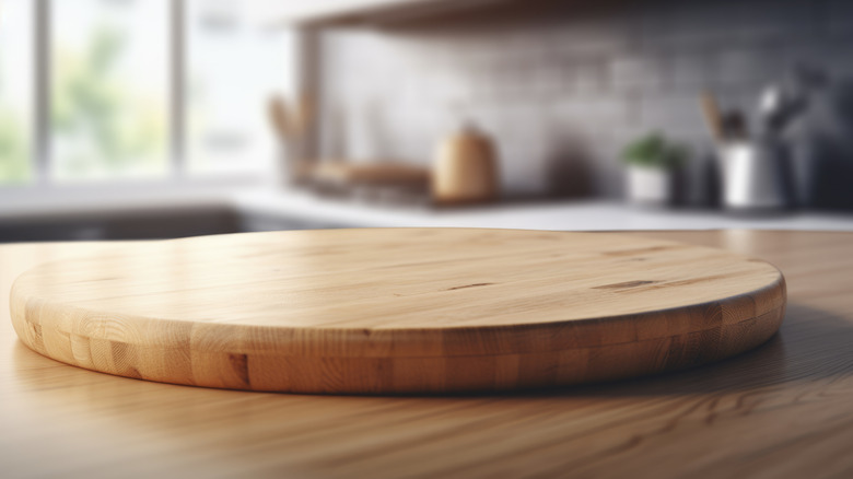 Extra wood from countertop used as rounded cutting board