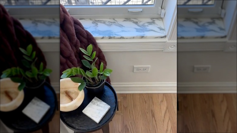 Marble windowsill ledge made with leftover marble countertop material