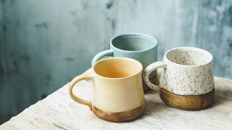 Three rustic mugs