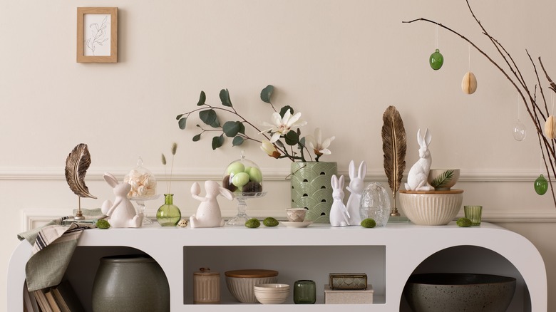 Display of knick knacks on white arched cabinet