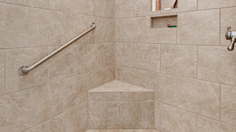 Corner shower bench with grab bar