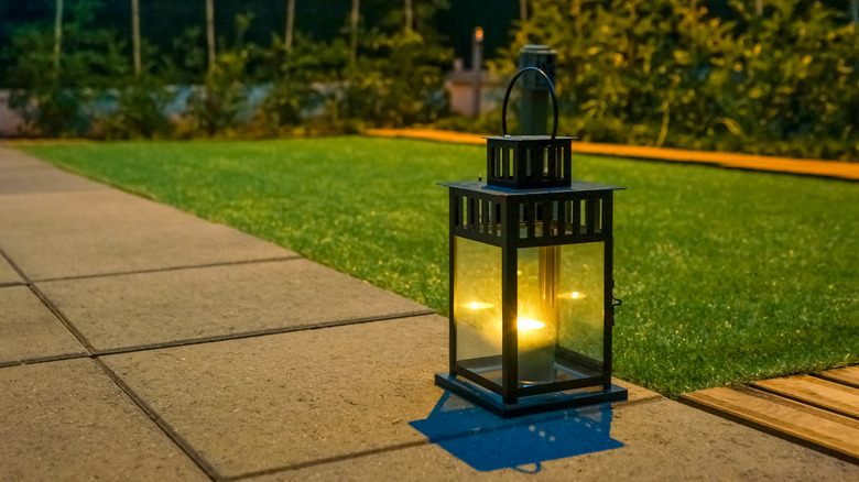 lantern sitting on paved path