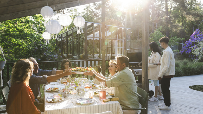 white lanterns above outdoor table