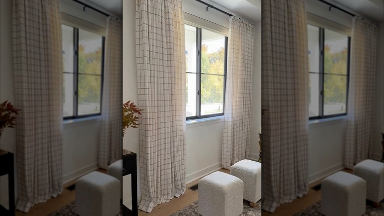 Tartan plaid curtains hanging in a front room