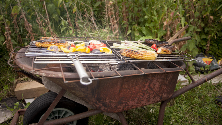 rusted wheelbarrow outdoor grill