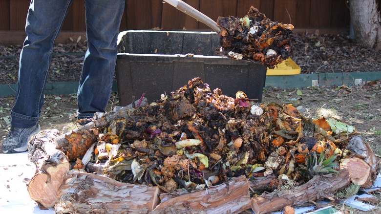 compost pile bordered with firewood