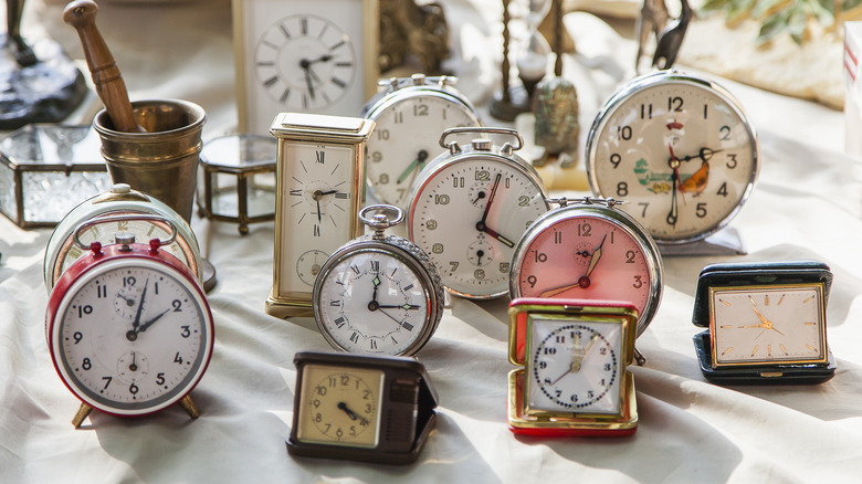 vintage antique clocks on table