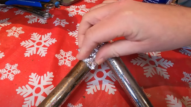 scrubbing metal with aluminum foil