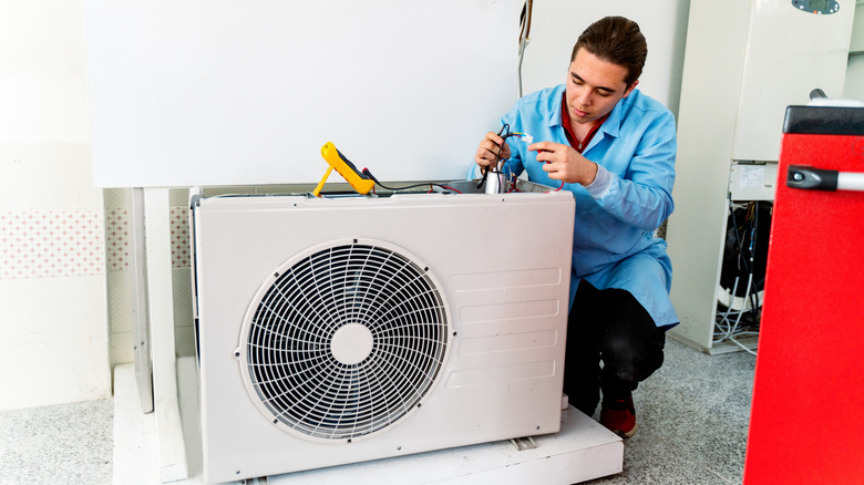 man installing aircon