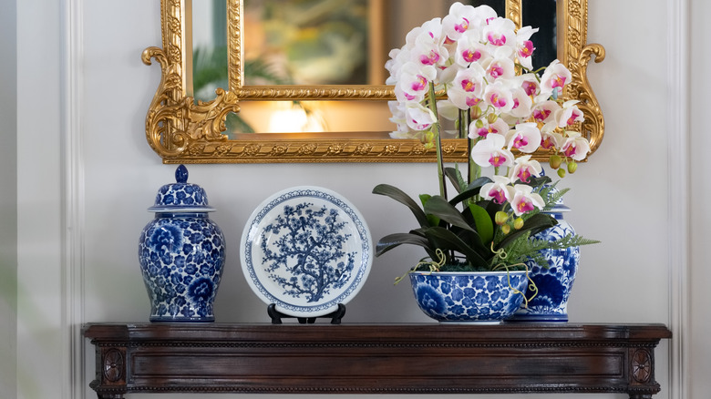 console decorated with ginger jars