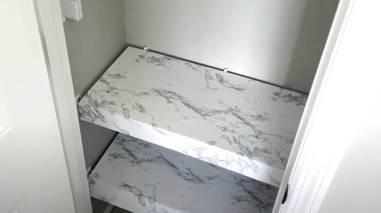 faux white marble over wire shelves