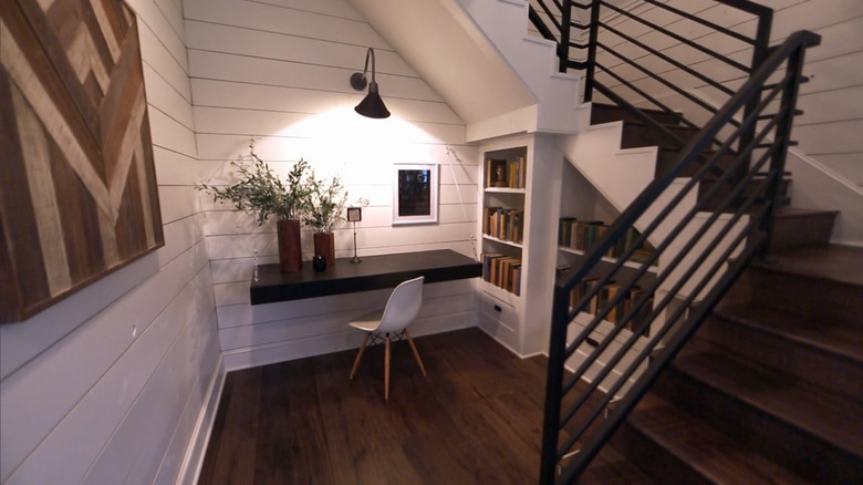 Library underneath wooden staircase