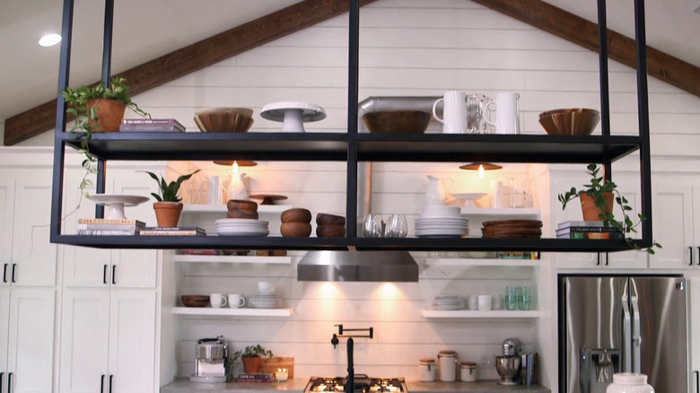 Ceiling-mounted shelf with dishes