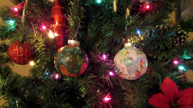 Christmas tree with pretty ornaments decorated with tissue paper