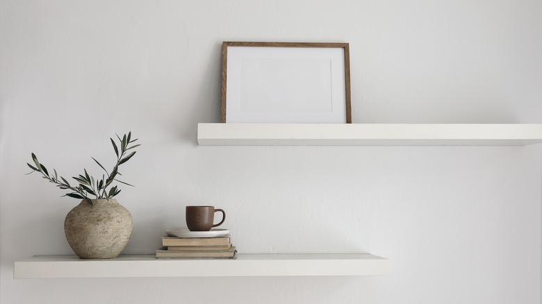 floating shelves with books and decorations