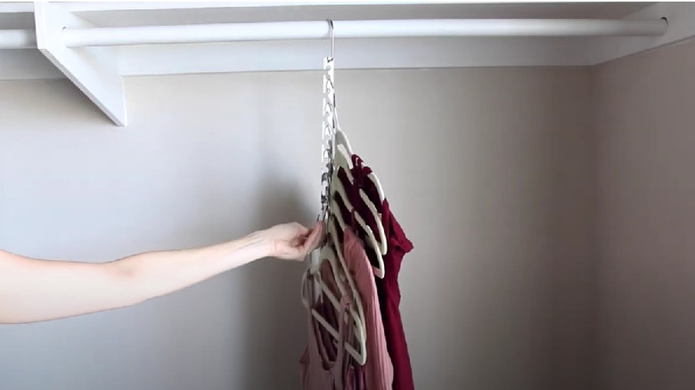 woman using a collapsible hanger