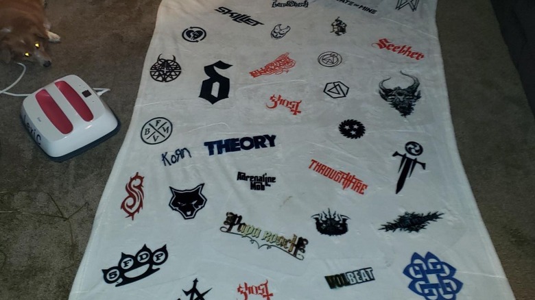 blanket with band names and logos