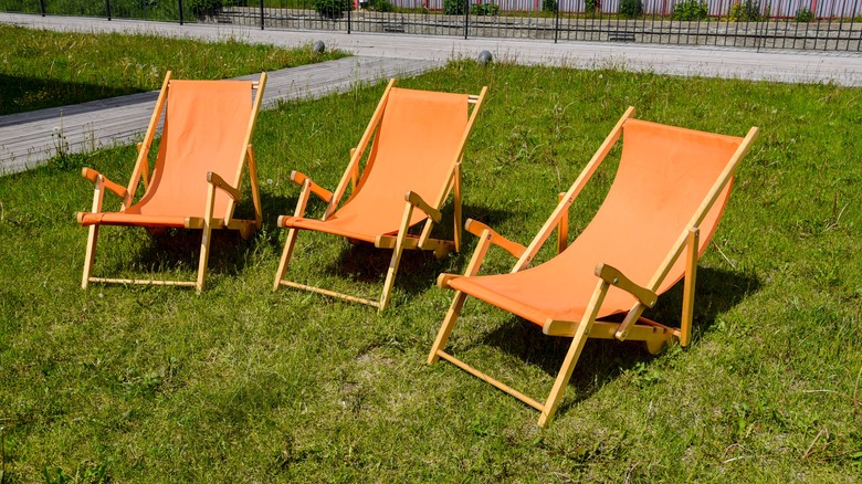 Three folding lawn chairs