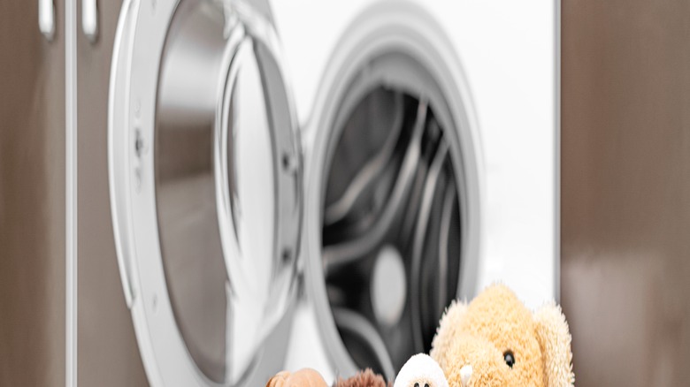 Children's toys in laundry basket