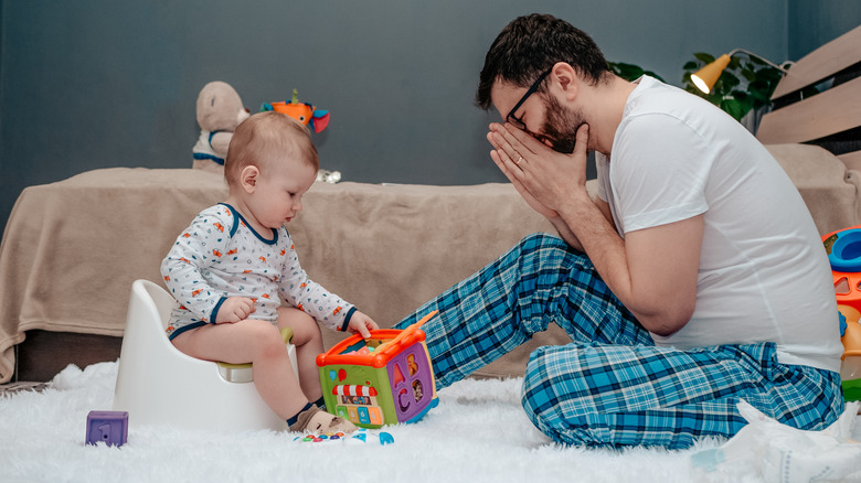 Father potty training son