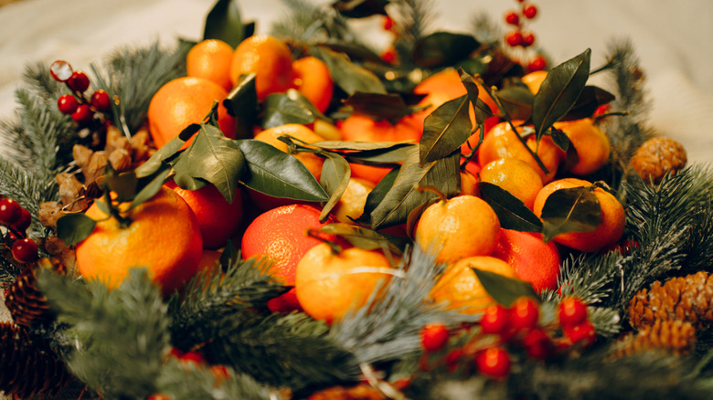 A centerpiece for the holidays holds delicious citrus fruits.