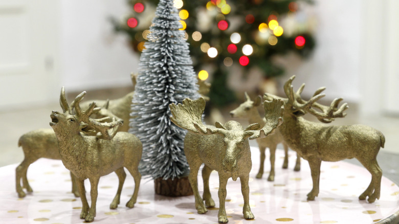 Gold painted reindeer, moose, and elk make a unique centerpiece display.