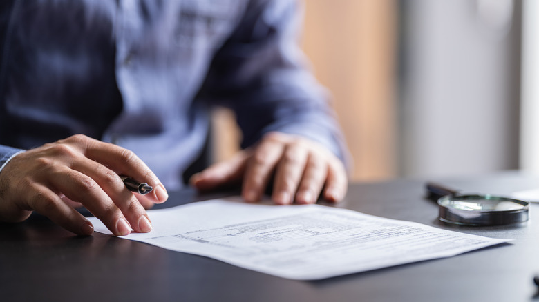 man studying pest control contract