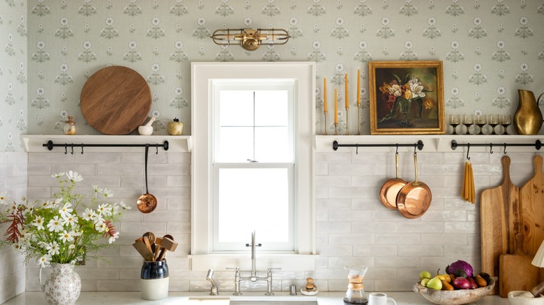 Neutral textured wallpaper above backsplash in kitchen