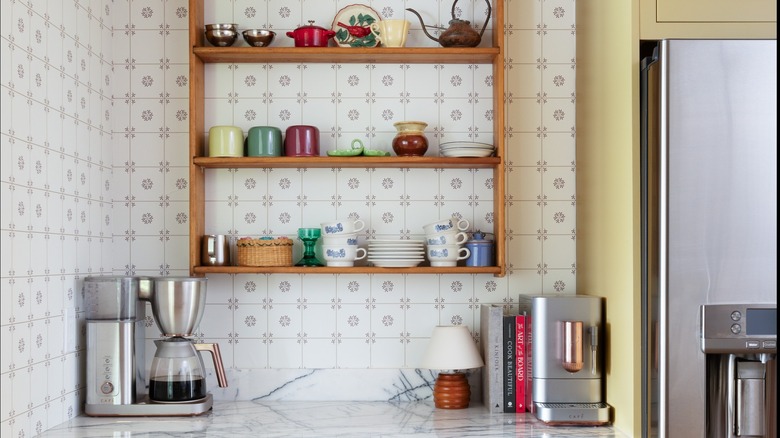 Wallpaper and retro appliances in kitchen corner