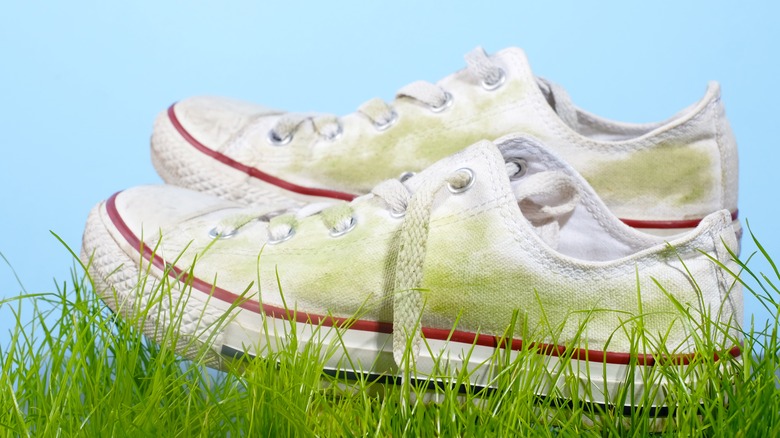 white sneakers with green grass stains