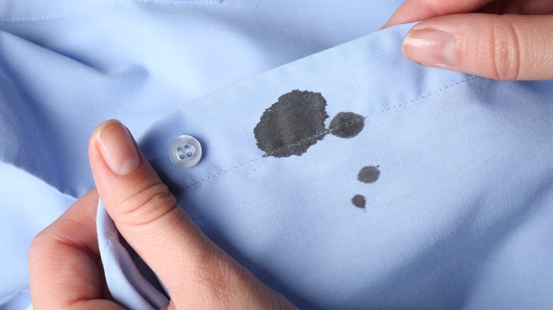 ink stain on blue shirt