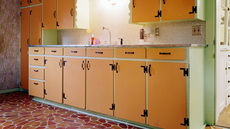 1970s kitchen with red and green cabinets