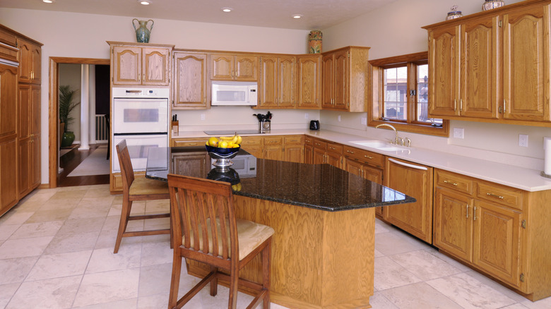 old kitchen with natural wood shaker cabinets