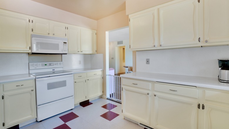 old kitchen with microwave above the stove