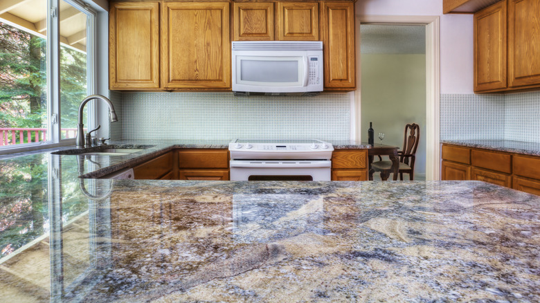 kitchen with speckled granite countertop