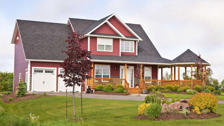 A typical two story house is painted brick red