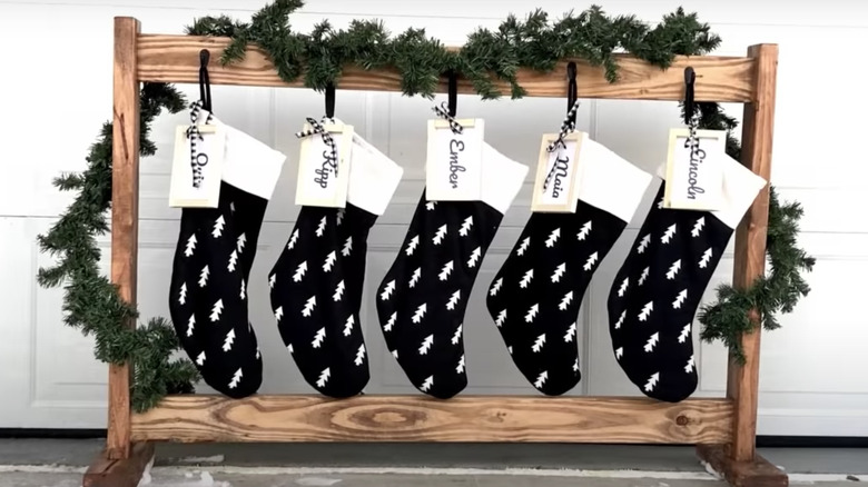 five stockings on wooden stand