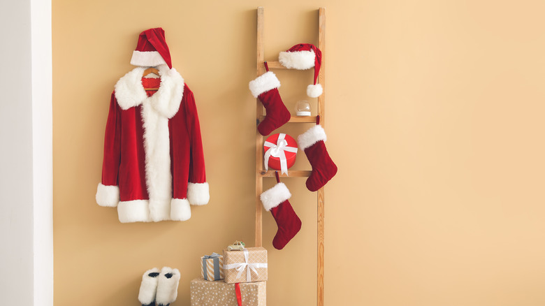 three stockings on wooden ladder