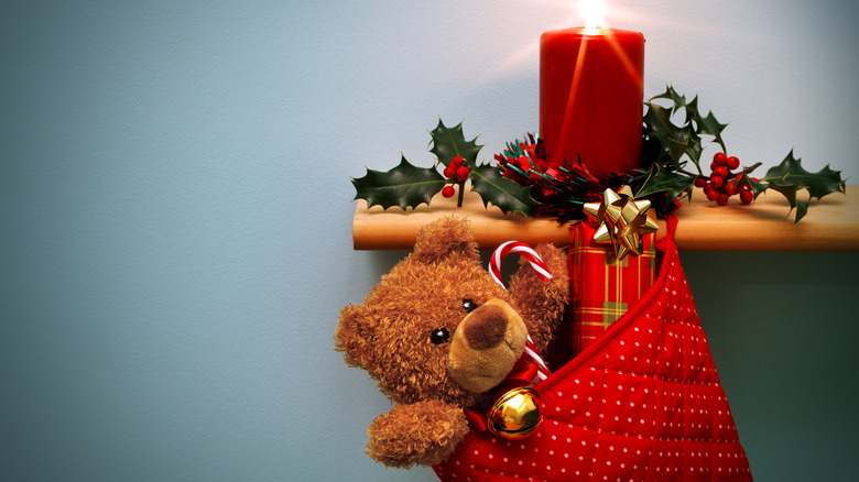 red stocking hanging from shelf