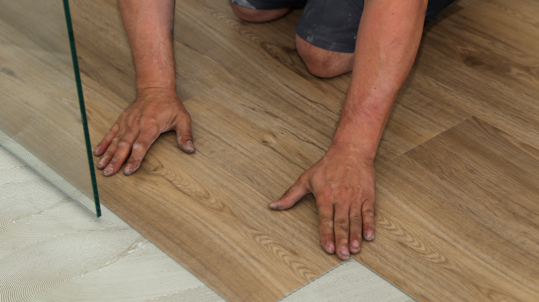 LVT flooring being fitted in bathroom