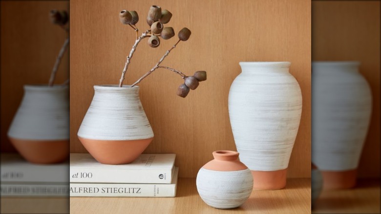 painted vases on a shelf