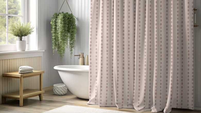 Gray bathroom with pastel pink shower curtain