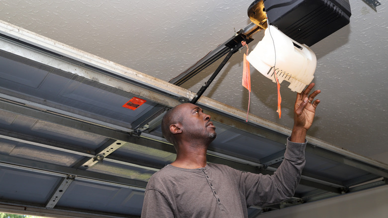 Man swapping out light bulbs