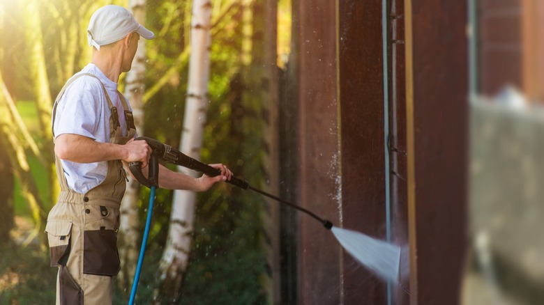 Power washing garage exterior