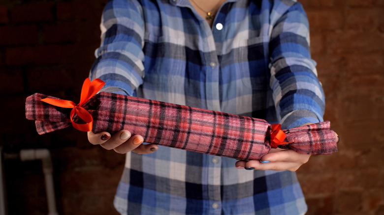 Large roll of wrapped Christmas crackers